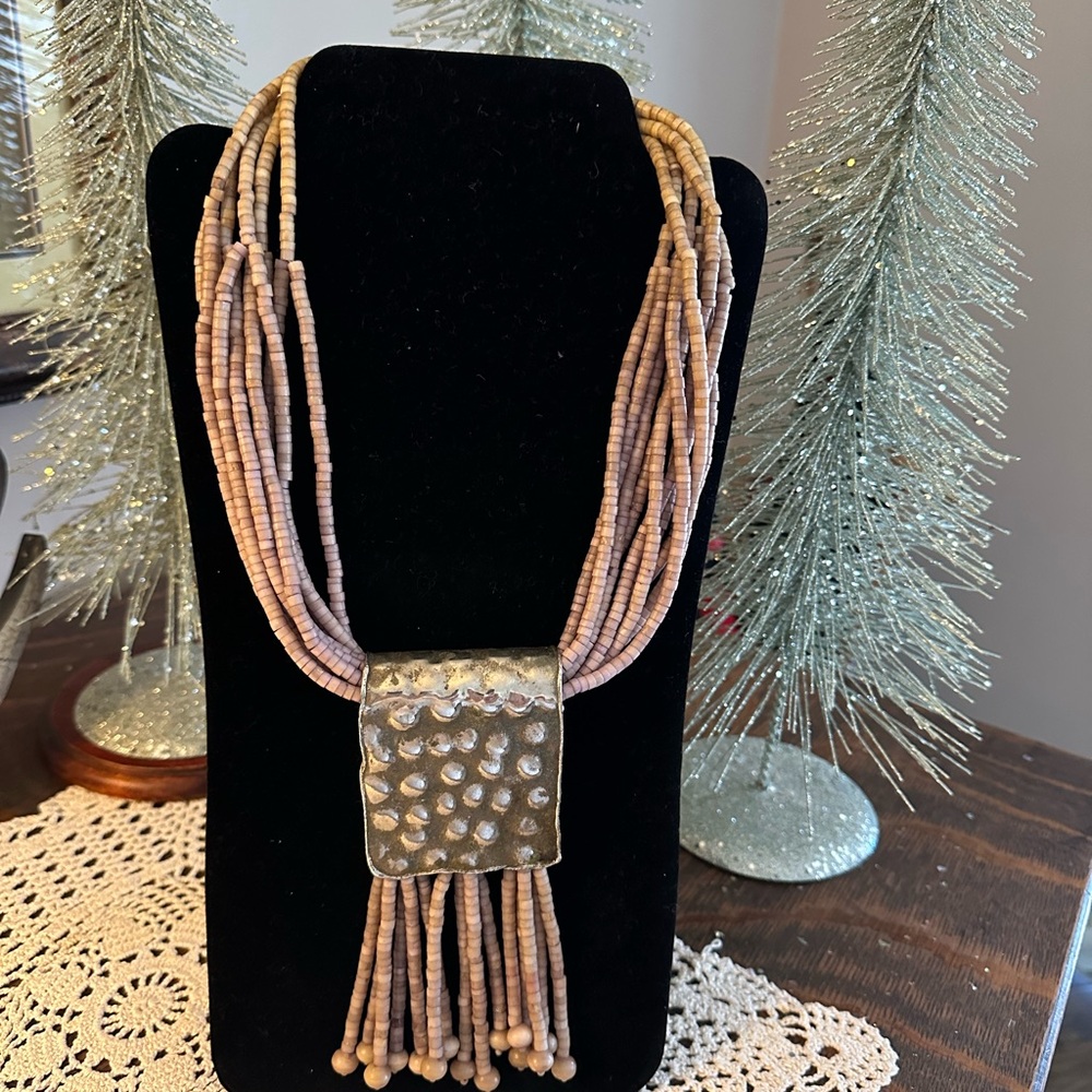 Unique necklace,made of bone beads & brass . Great shape,